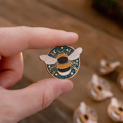 Hard Enamel Bee Pin on the hand