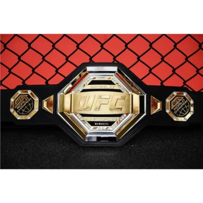 gold UFC championship belt with black belt