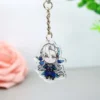 Llavero acrílico Genshin Impact con un personaje de anime azul y blanco, que luce colores vibrantes y un intrincado diseño.