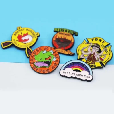 A collection of uniquely designed badges, each displaying distinct colors and patterns, arranged for visual interest.