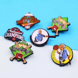 A collection of colorful baseball pins arranged on a vibrant blue surface, showcasing various team logos and designs.