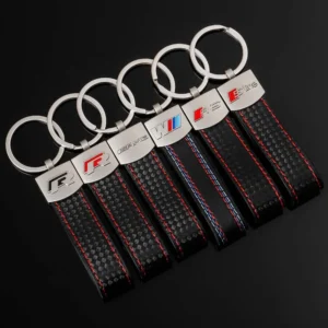 A BMW keychain featuring distinctive red and blue stripes, showcasing the brand's iconic colors and sleek design.