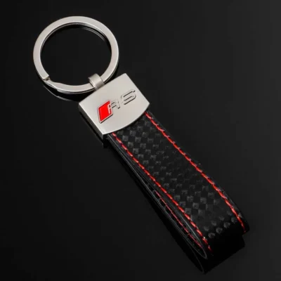 A black and red keychain featuring the iconic Mercedes logo prominently displayed.