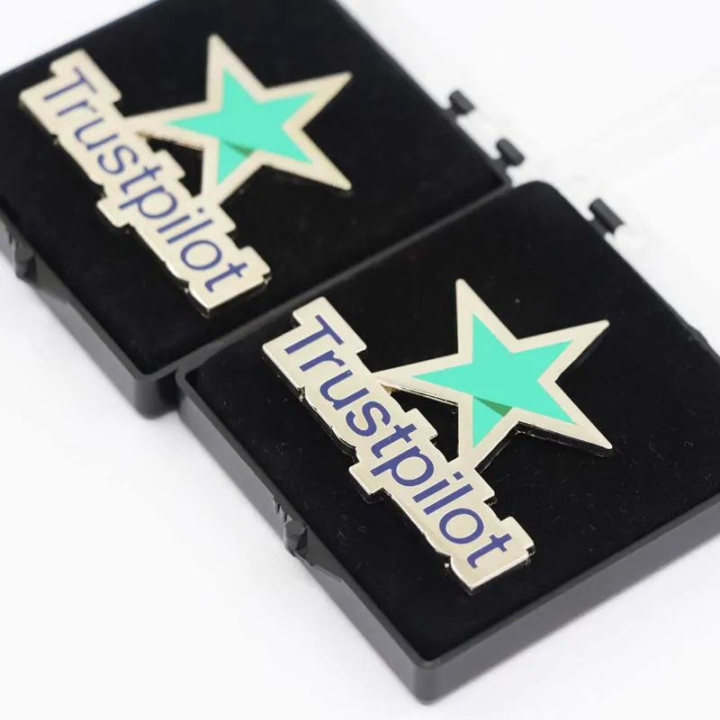 Display two Trustpilot pins side-by-side to symbolize trustlipot's recognition of Peakeen and the production of pins in peakeen