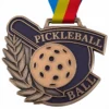 A medal featuring a pickleball design, symbolizing achievement in the sport of pickleball.