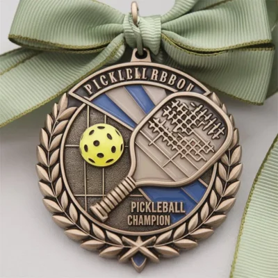 Close-up of a pickleball champion medal, showcasing its intricate design and representing excellence in pickleball.