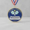 Custom pickleball medal featuring the Peeken logo, showcasing a unique design for sports achievements.