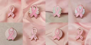 8 pink ribbon pins with a heart, signifying love and support for important health and social causes.