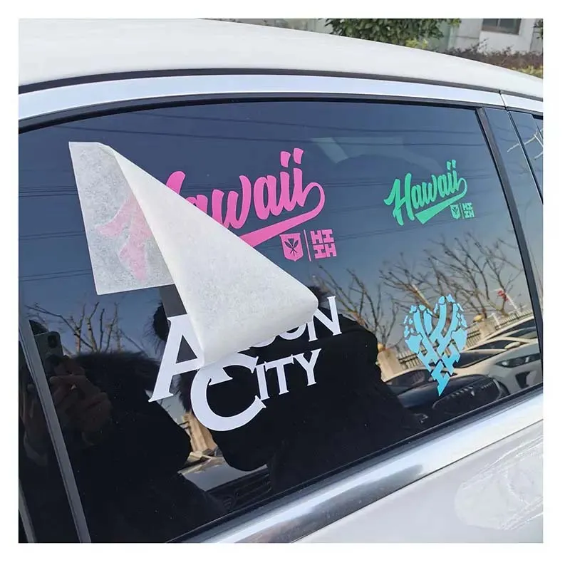 A car adorned with colorful stickers on its windows, showcasing a playful and personalized design.