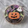 Black and white button featuring the text "Happy Halloween," designed as a custom Halloween pin badge.