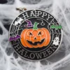 Black and white button featuring the text "Happy Halloween," designed as a custom Halloween pin badge.