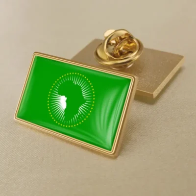 Green and gold pin featuring the African Union flag, ideal for wholesale distribution.