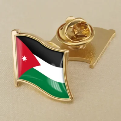 A lapel pin featuring the flag of Jordan, showcasing its vibrant colors and design for patriotic display.