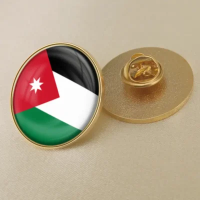 A lapel pin featuring the flag of Jordan, showcasing its vibrant colors and design for patriotic display.