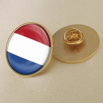 Gold and blue pin featuring the Netherlands flag, ideal for wholesale distribution.