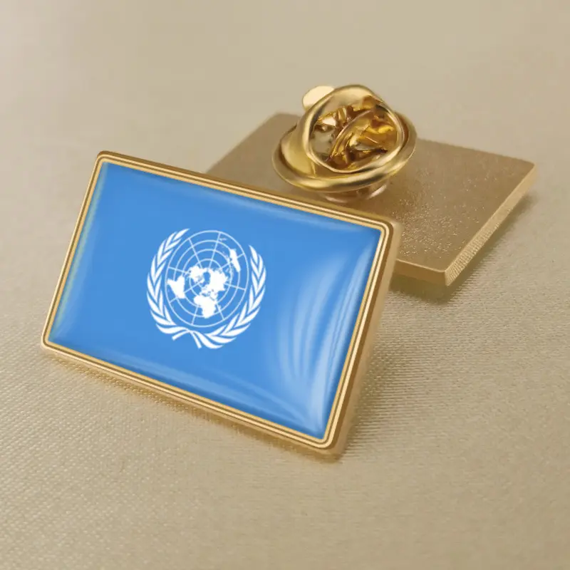 A United Nations logo pin, symbolizing global unity, available for wholesale purchase.