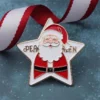 Festive custom pin showcasing Santa Claus with "Peakeen Merry Christmas" text, ideal for holiday events and gifts.