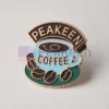 Custom enamel pin featuring a peakeen coffee design, perfect for coffee lovers and collectors.
