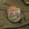 Custom enamel pin featuring a peakeen coffee design, perfect for coffee lovers and collectors.