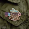 Custom enamel pin featuring a peakeen coffee design, perfect for coffee lovers and collectors.