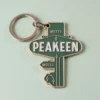 Llavero de hotel personalizado con la palabra "peakeen" en un elegante diseño, perfecto tanto para huéspedes como para coleccionistas.