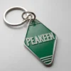 Llavero de hotel personalizado con la palabra "peakeen" en un elegante diseño, perfecto tanto para huéspedes como para coleccionistas.