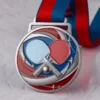 Custom table tennis medal featuring a ping pong ball and a tennis racket design.