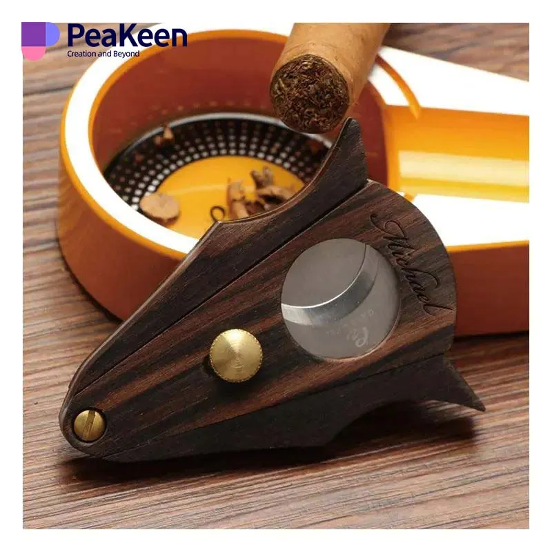 A wooden cigar cutter featuring an elegant gold handle, perfect for a refined smoking experience.