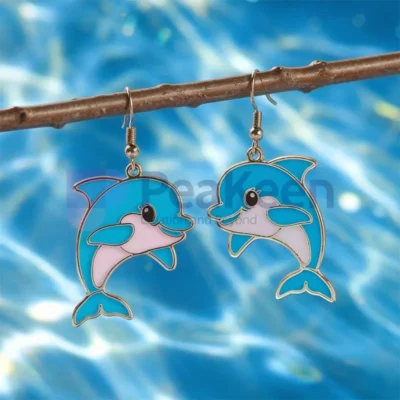 Custom soft enamel dolphin earrings featuring vibrant blue and pink beads, perfect for ocean lovers and unique jewelry enthusiasts.