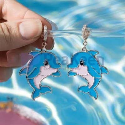 Custom soft enamel dolphin earrings featuring vibrant blue and pink beads, perfect for ocean lovers and unique jewelry enthusiasts.