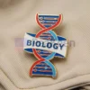 Custom pin featuring the word "Biology," designed for science enthusiasts and educators.