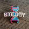Custom pin featuring the word "Biology," designed for science enthusiasts and educators.