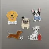 A set of four colorful refrigerator magnets featuring playful dogs and cats.