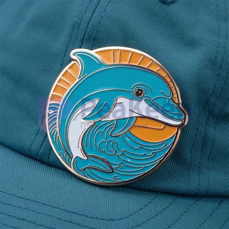 A custom dolphin pin rests on an open book, symbolizing a love for marine life and literature.