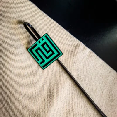 Custom Islamic bookmarks featuring a stylish green and black square hairpin design.