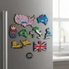 A colorful refrigerator magnet featuring flags and names of various countries from around the world.