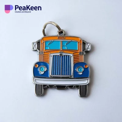 A vibrant red, white, and blue truck pin, designed as a custom metal keychain for truck lovers and collectors.