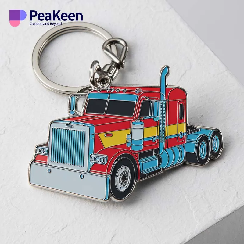 Custom metal truck keychain in red and blue against a clean white background.