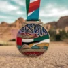 Una medaglia personalizzata con la bandiera degli Emirati Arabi Uniti, simbolo di successo e orgoglio nazionale.
