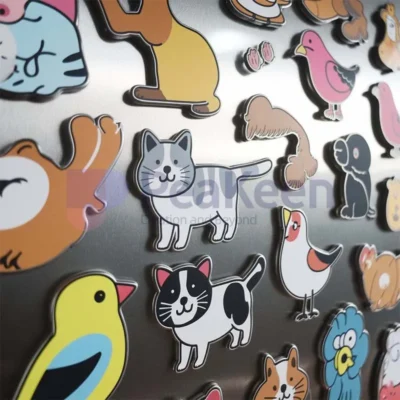 A collection of colorful cat and dog stickers designed as custom animal fridge magnets.