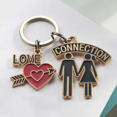 Custom couple keychain featuring the words "Love Connection" with a decorative arrow design.