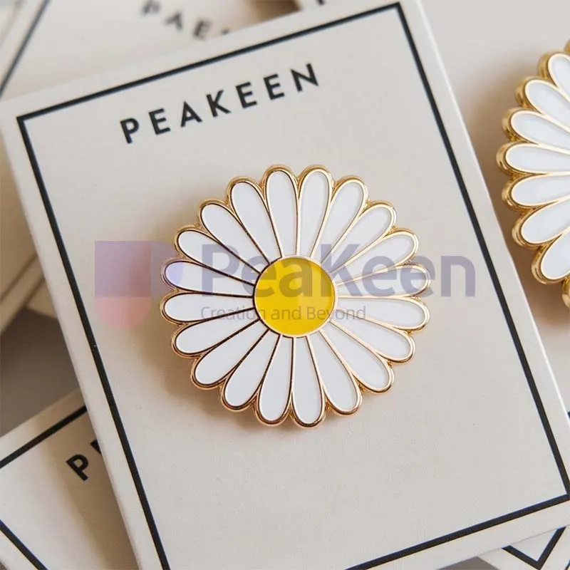 Custom white and yellow daisy pin displayed on a card, showcasing its vibrant colors and intricate design.