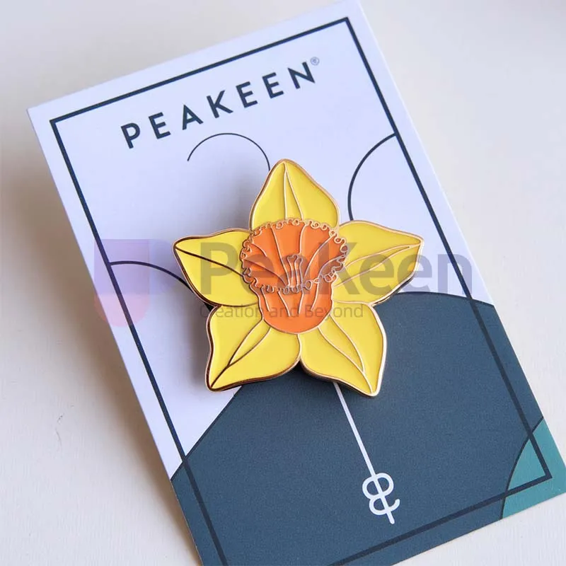 Custom daffodil enamel pin featuring a vibrant yellow flower design, perfect for adding a touch of spring to any outfit.