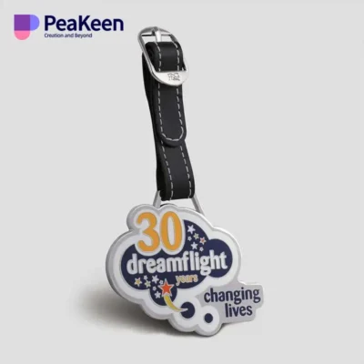 A luggage tag featuring the phrase "Dreamflight Changing Lives," designed for golf bags.