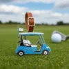 A golf cart key tag resting on a lush green golf course, showcasing its vibrant colors and design.