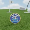 A golf ball marker featuring a cartoon character design, adding a playful touch to the game.