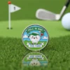 A golf ball marker featuring a cartoon golf ball and a "hole in one" tee time pin design.