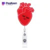 A red heart-shaped badge holder with a matching red ribbon, designed for nurse badge reels.