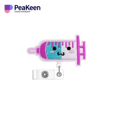 A cheerful needle with a smiley face, designed for nurse badge reels, adding a touch of charm to healthcare attire.