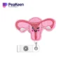 A pink purse clip featuring a cute heart design, perfect for nurse badge reels and adding charm to any outfit.